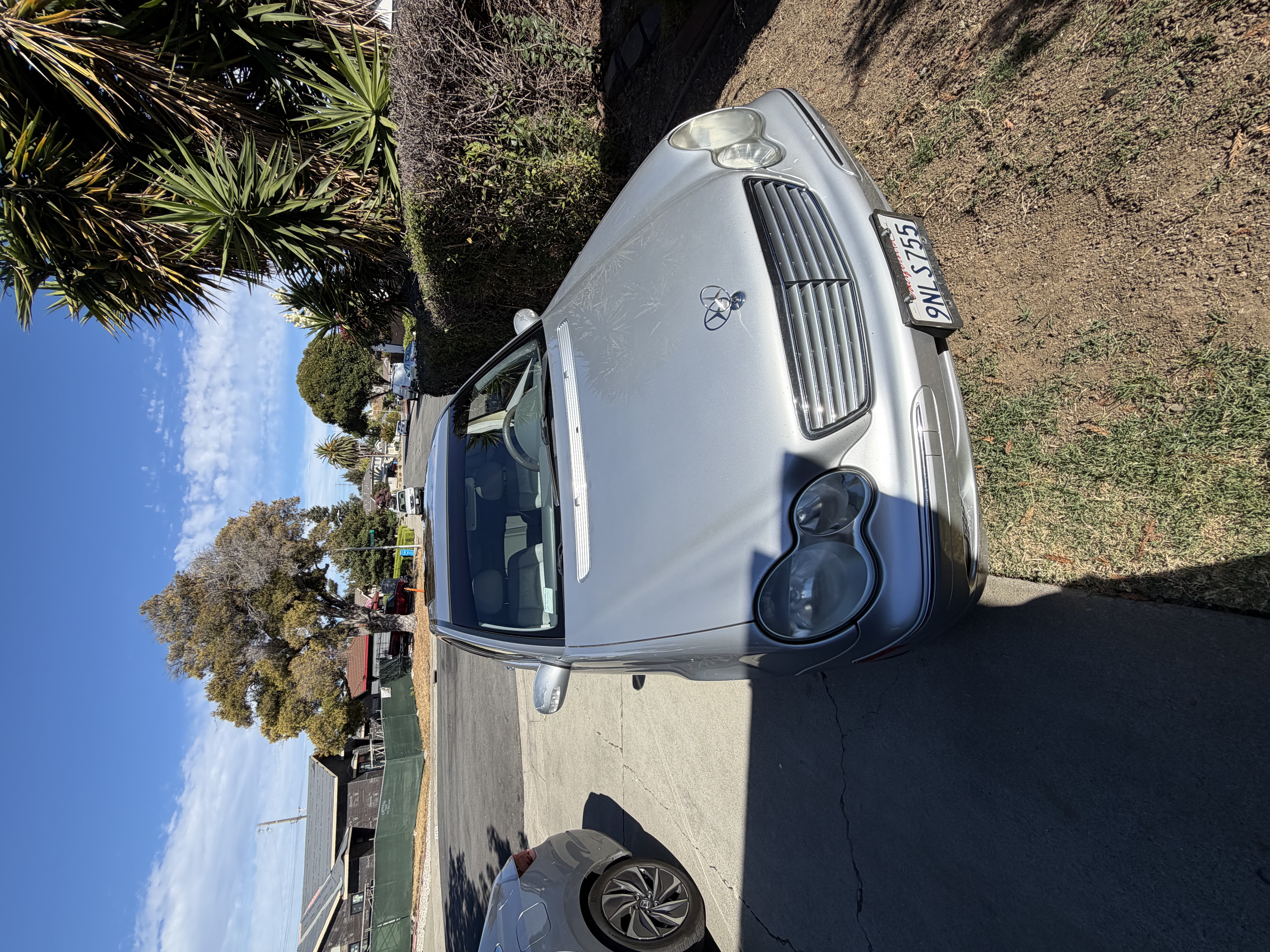 Gleaming metallic silver Mercedes-Benz C250 profile after premium exterior wash
