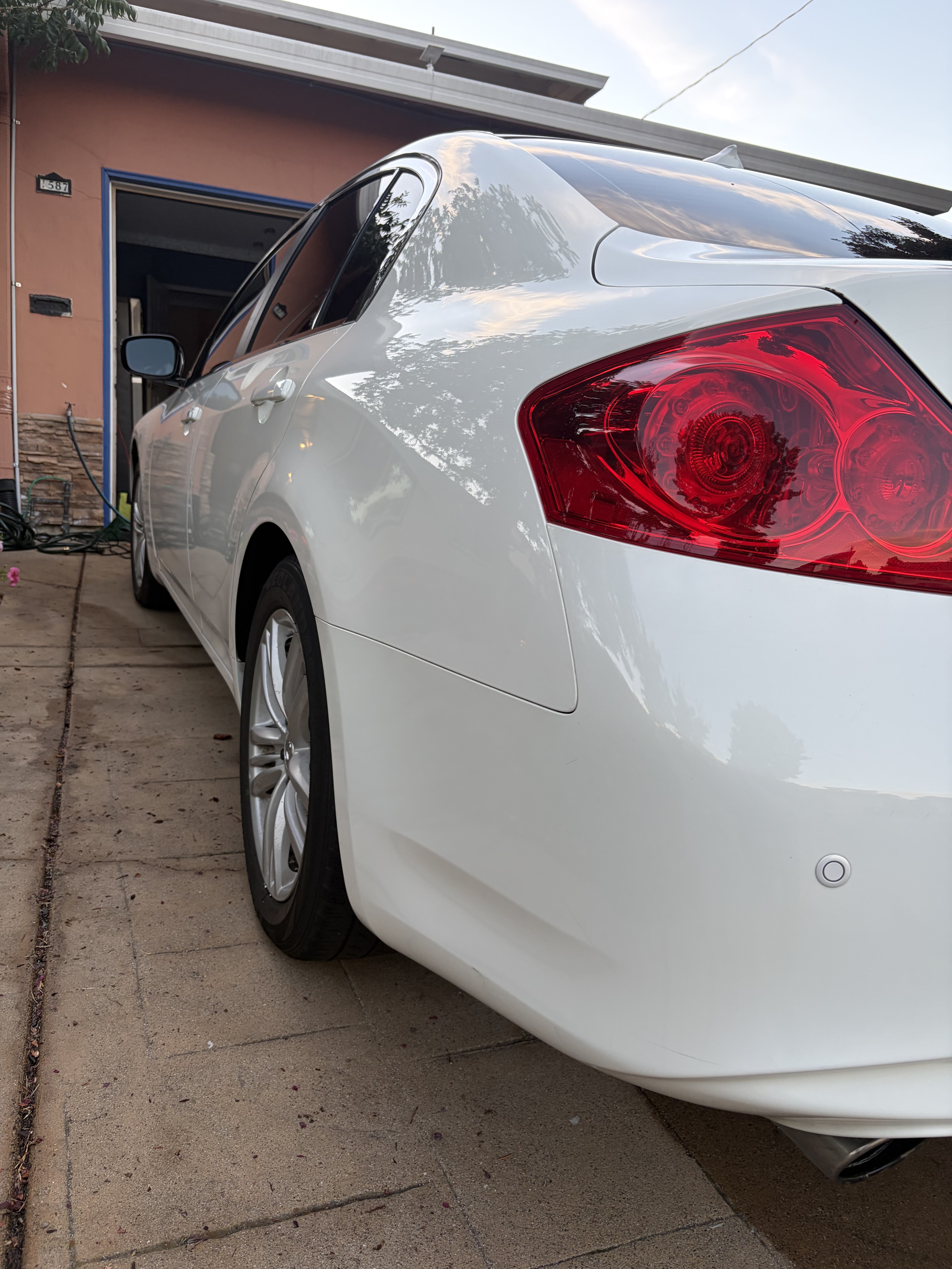 Flawless glass-like finish on black car paint after professional deep wash and seal