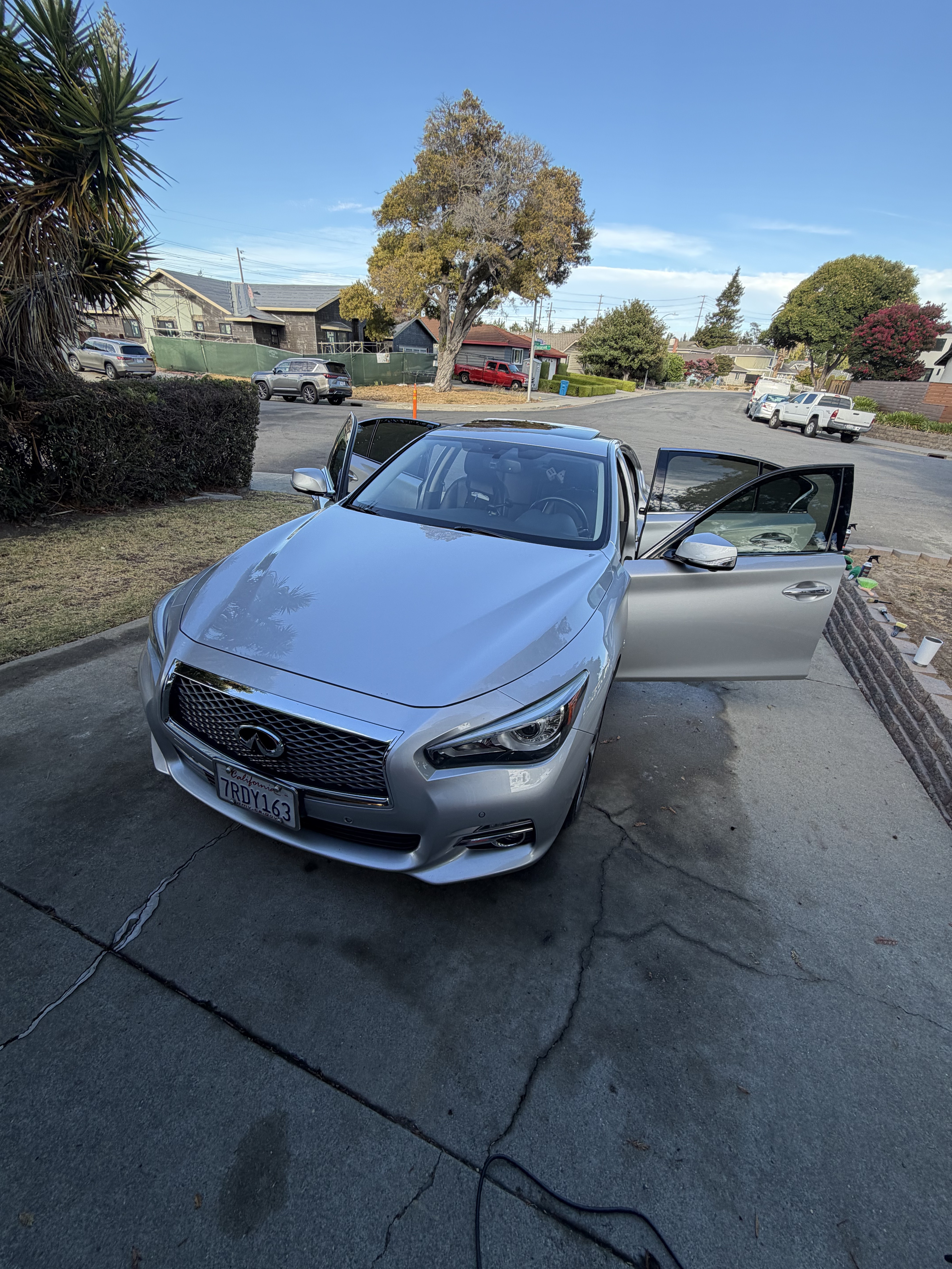 Gleaming black Infiniti Q50 showing premium paint protection and showroom shine